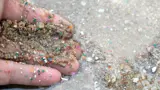 Microplastics Ocean Hand